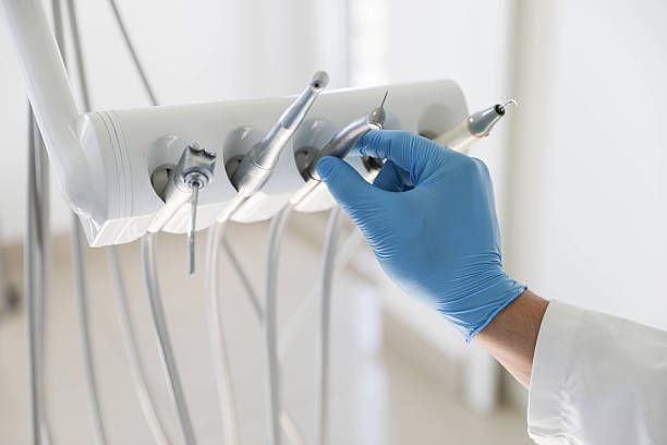 Professional Emergency Dentist technician working in East Farmingdale, NY